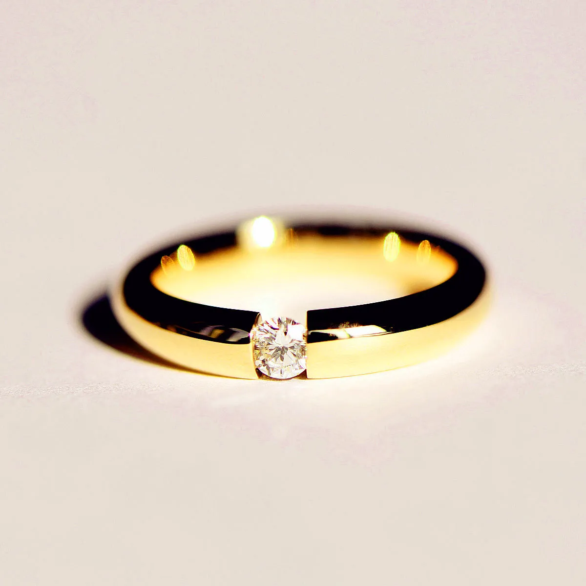 Tension Set Diamond Couples Wedding Ring