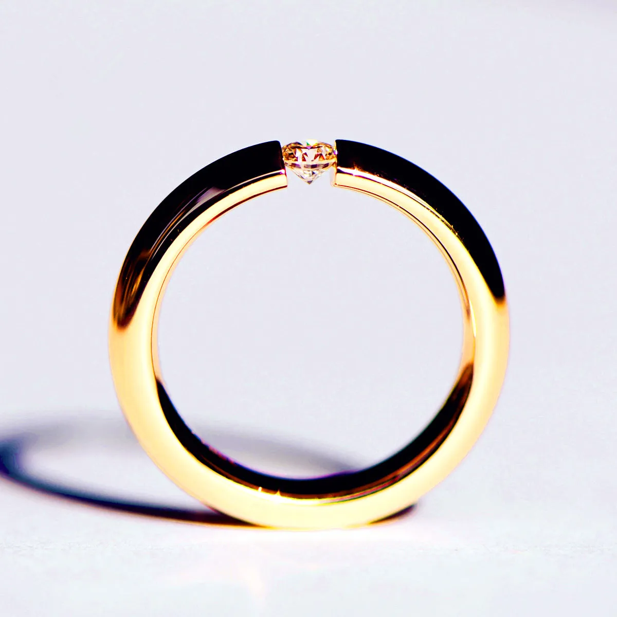 Tension Set Diamond Couples Wedding Ring
