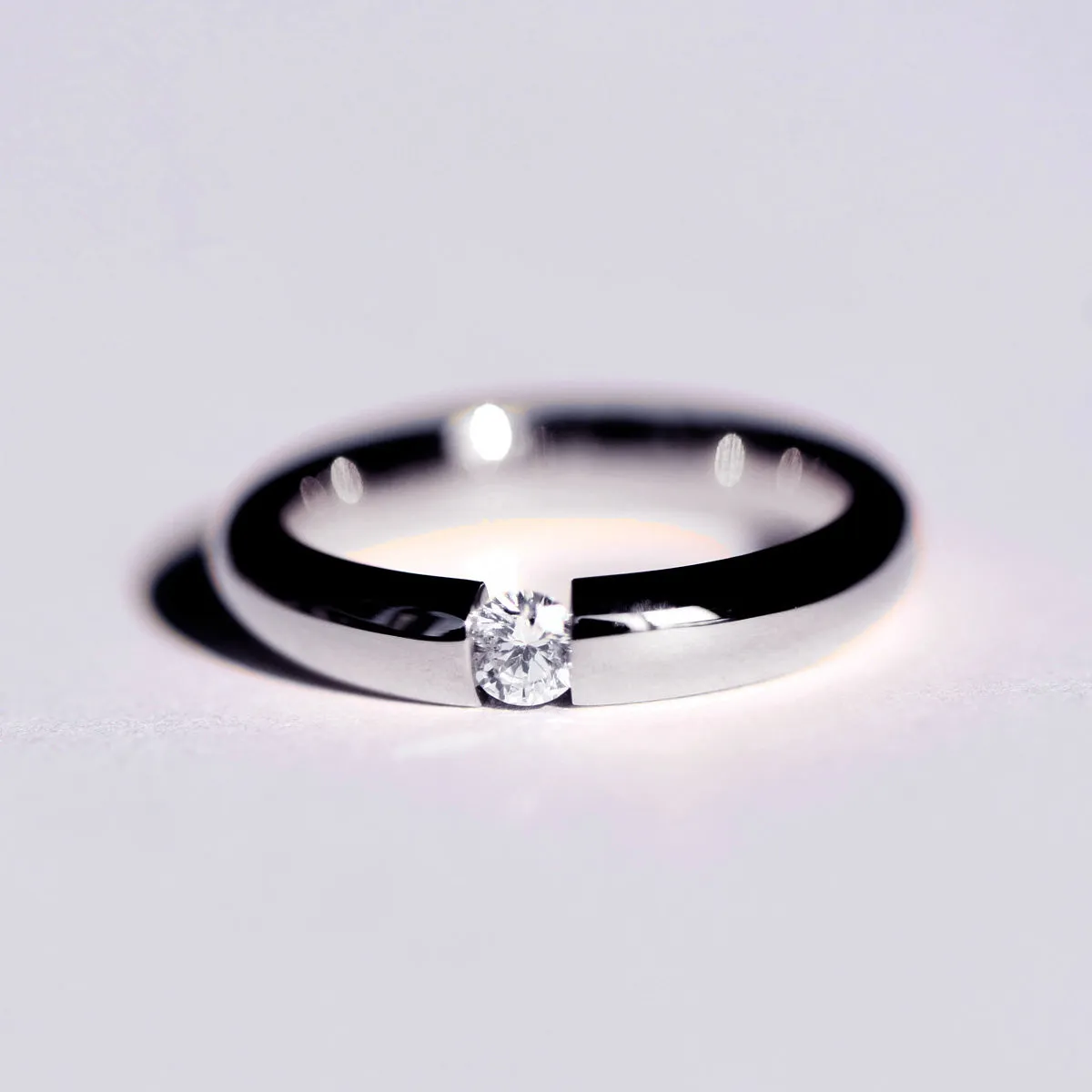 Tension Set Diamond Couples Wedding Ring
