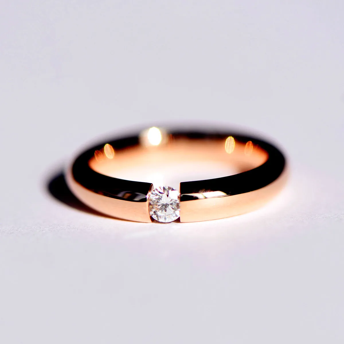 Tension Set Diamond Couples Wedding Ring