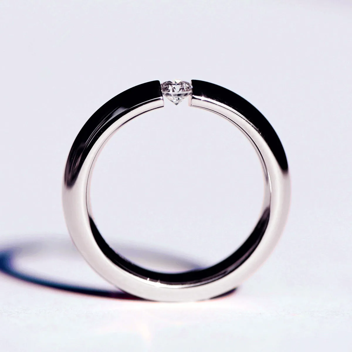 Tension Set Diamond Couples Wedding Ring