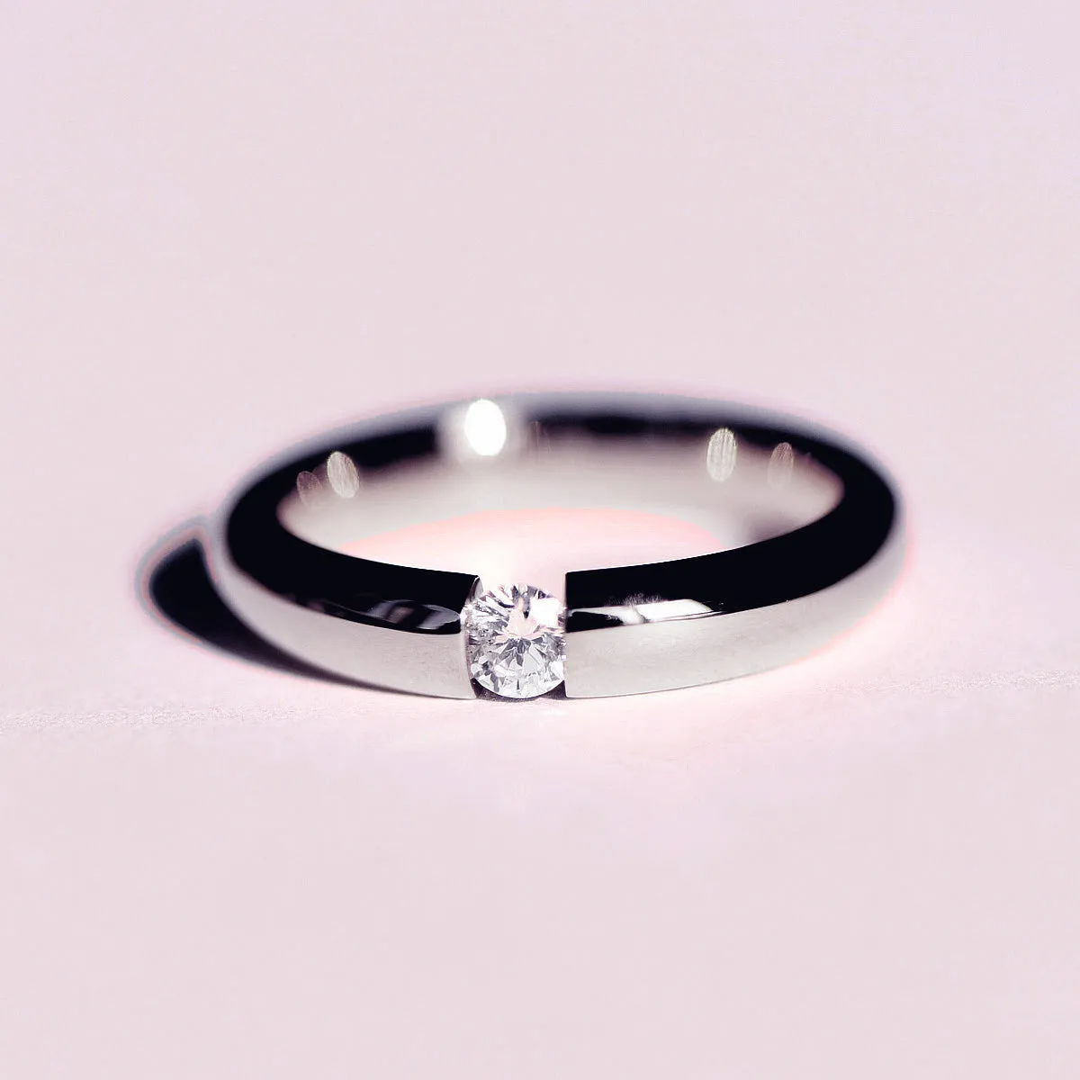 Tension Set Diamond Couples Wedding Ring