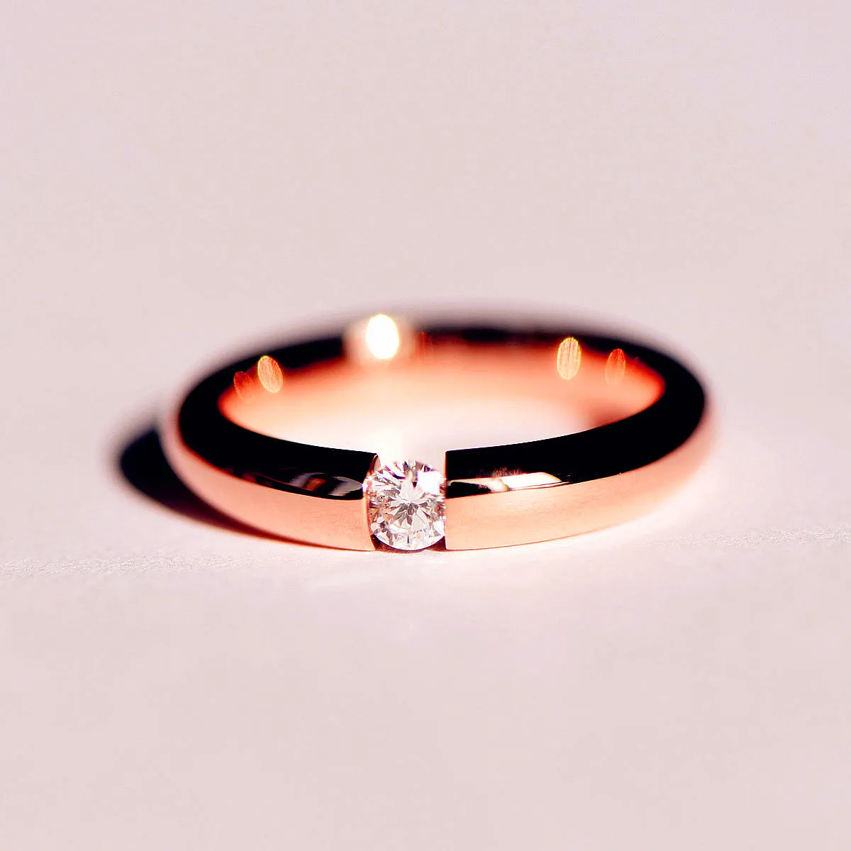 Tension Set Diamond Couples Wedding Ring